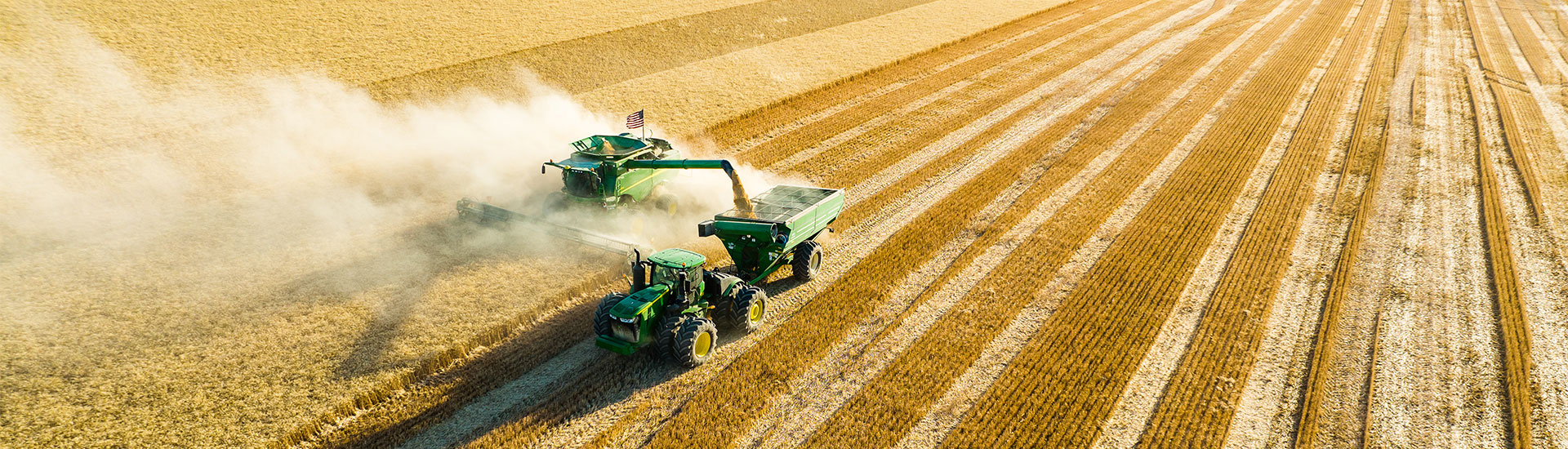 combine and grain cart in a field